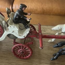 Antique cast iron horse drawn fire wagon. Metal decor, Christmas, toy