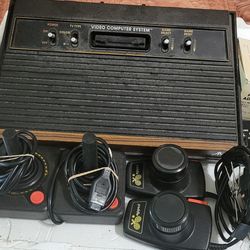 Atari 2600 gaming system + 9 games