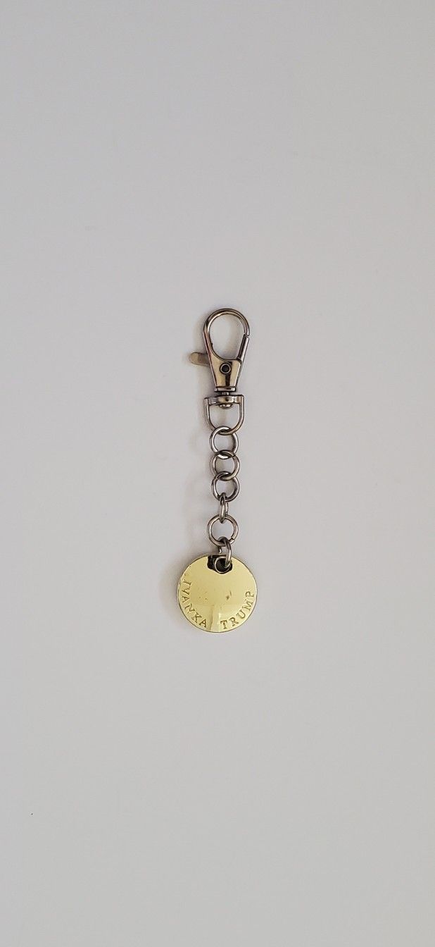 Ivanka Trump purse charm hang tag