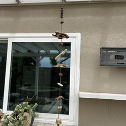 Beautiful beach-themed wind chime featuring multiple ceramic sea turtles 