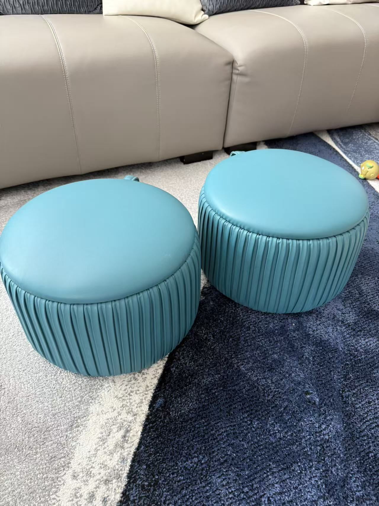 Round upholstered ottoman