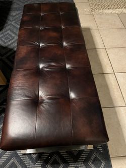 Brown leather bench