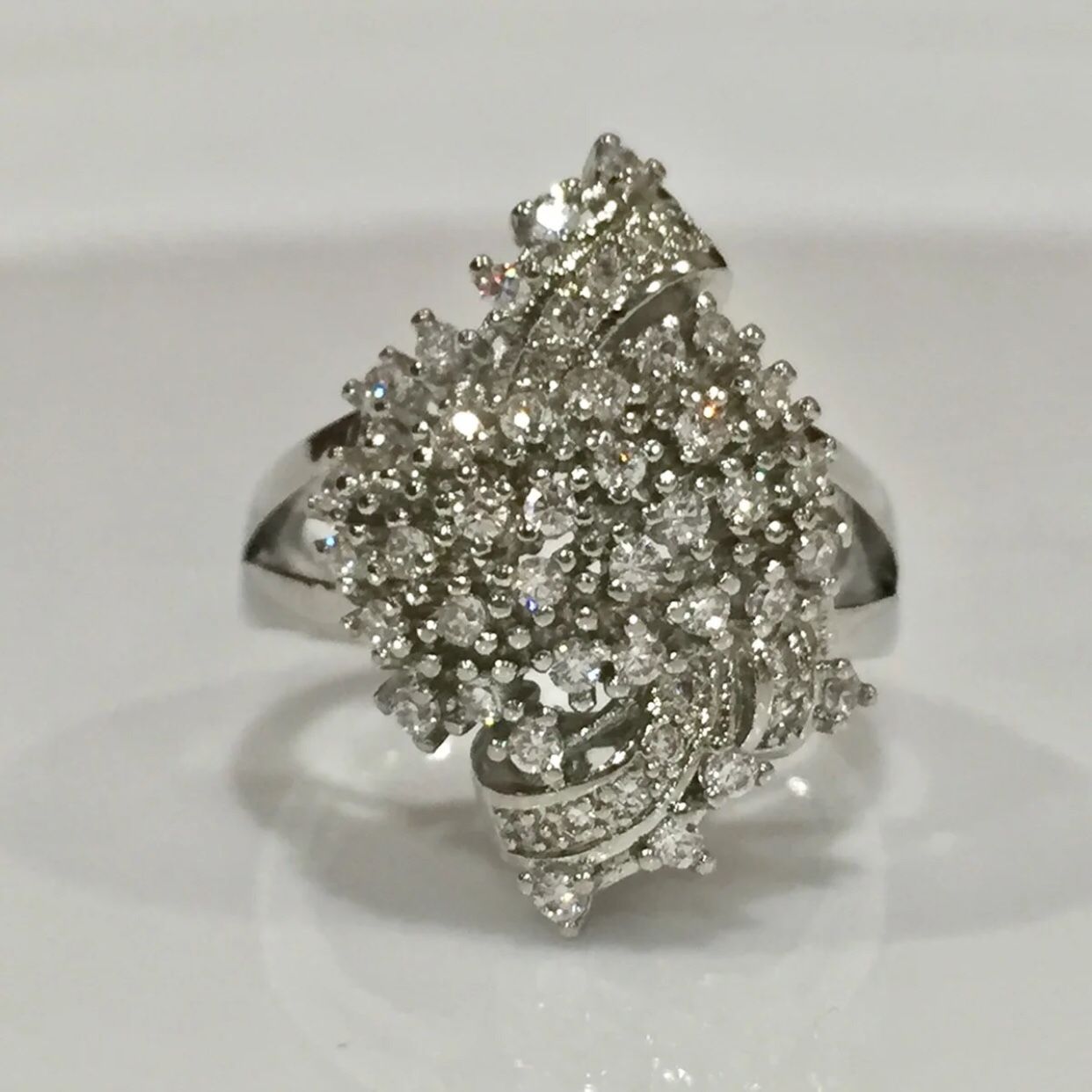 Silver stimulated diamond cluster ring