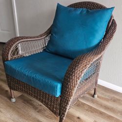Brown Wicker Armchair with Teal Cushions