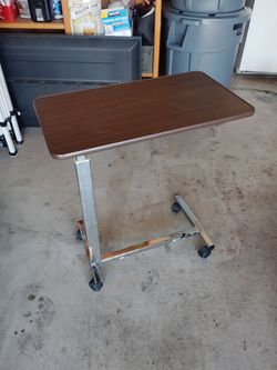 Rolling adjustable bedside table