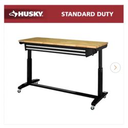 BRAND NEW IN BOX Husky 62 in. W x 24 in. D 2-Drawer Adjustable Height Black Workbench Table with Solid Wood Top