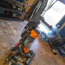 Dyson Dc25 Vacuum Cleaner With Different Attachments