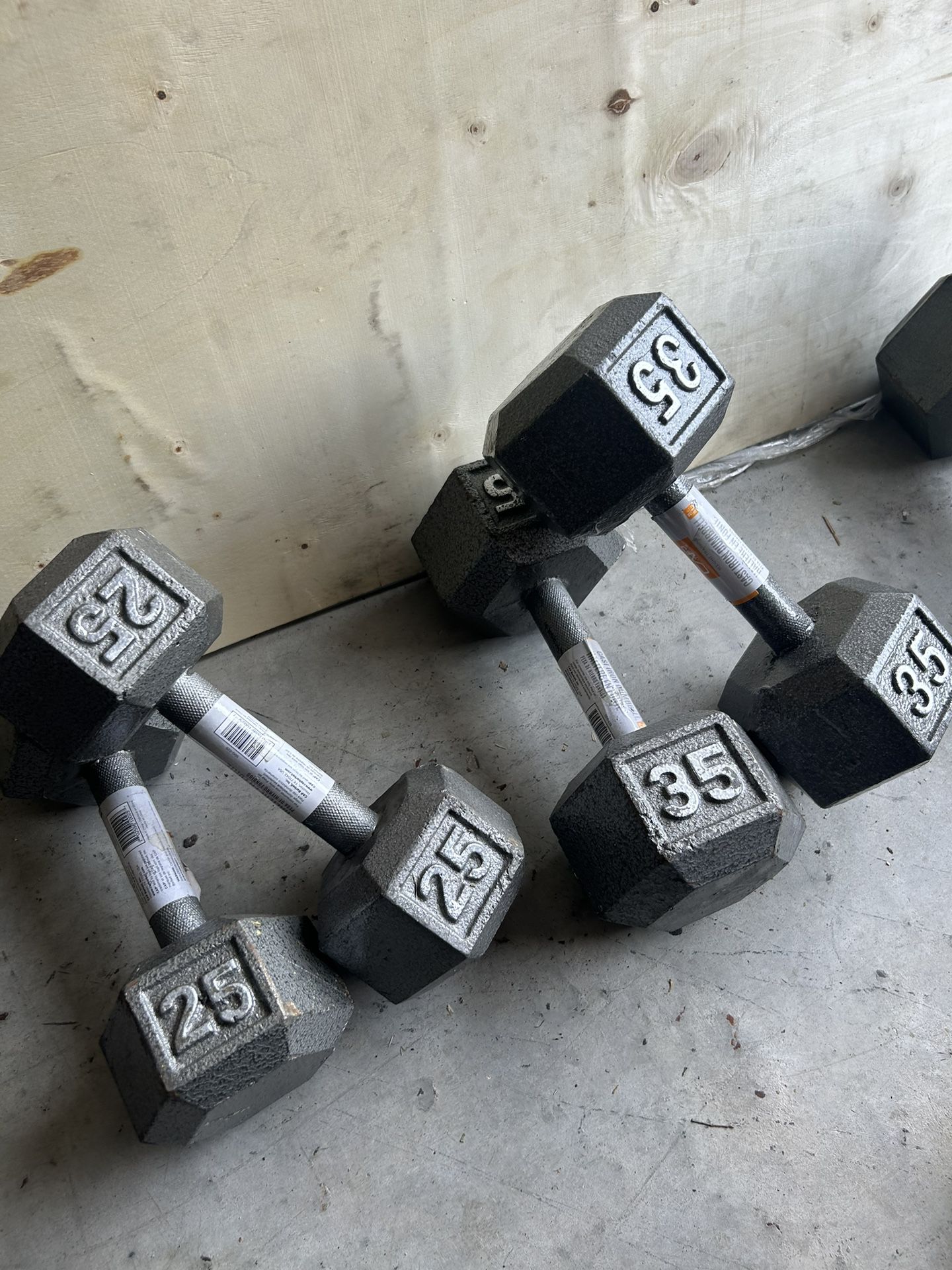 New pair of 25 and 35lb iron dumbbells