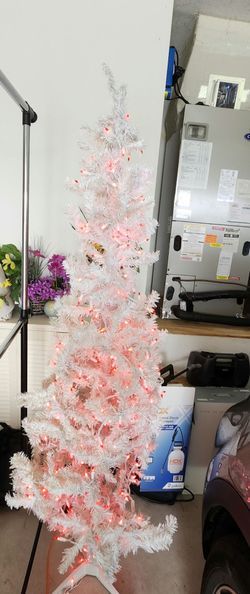 White Christmas tree with built-in red lights. Height: 6"