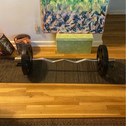 Brand New NEVER USED!! Curling Bar With Two 35 Lb Plates