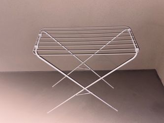 White metal folding clothes drying rack
