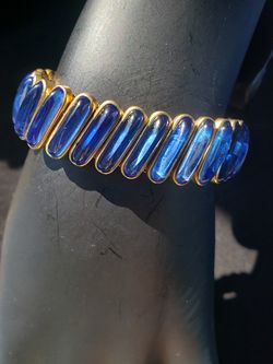 $69. Victorian/Edwardian 1900's CARMEN 10K Gold Filled bracelet with stretch band and blue glass stones. Fits a wrist up to 8 inches. 5/8 inch width.