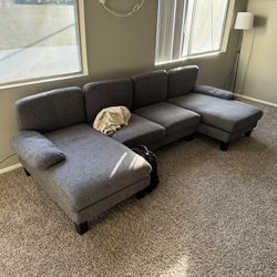 Grey U shaped Couch