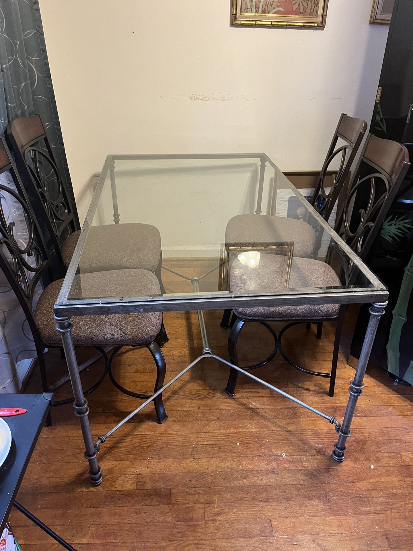 Iron Glass top Table And Four Upholstered chairs