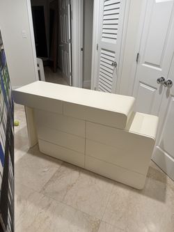 Our cozy cream-colored handleless dresser and desk—already put together for you!