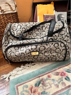 Nicole Miller leopard duffel bag. Used in good condition. Great for traveling, shopping or storage. See pictures. $15