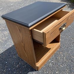 Nightstand oak with black top Single drawer slides great #0540 Not real oak.  Particle board   Top had some problems so I had to sand it and paint it 