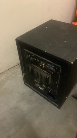 Single large woofer in a plain black MDF box 	•	Bare speaker wire terminals (red/black wire visible) → not powered 	•	No visible brand badge or model 