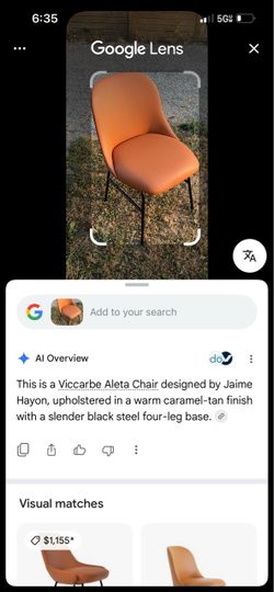 Viccarbe Aleta Chair by Jaime Hayon (set of 4) features a warm orange upholstered shell paired with a sleek black four-leg metal base.