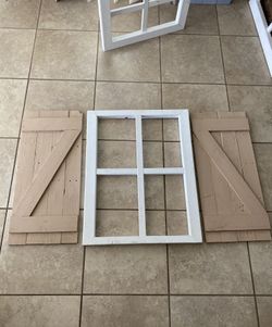 Window frame with shutters