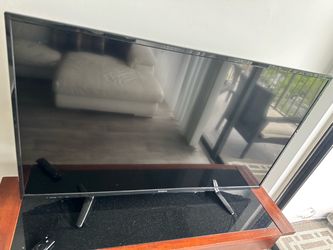 TV and adjustable tv mount table