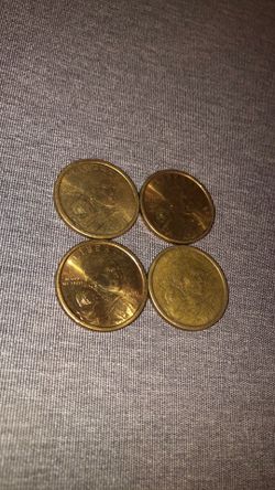 4 coins dated 2000 Sacajawea dollars