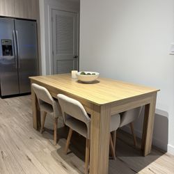 Wood Table With 4 Chairs Table Opens For 8 People and A sofa 