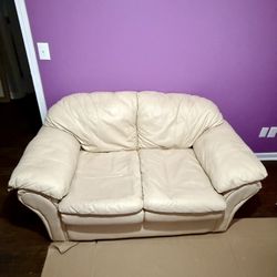 BEIGE LEATHER LOVE SEAT 