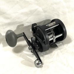 New Shakespeare (Tidewater-T20LO) graphite frame, medium, heavy action, fishing reel