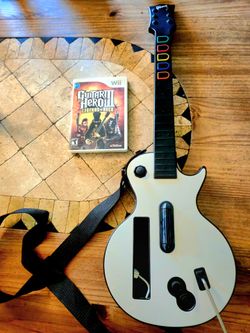 Wii Guitar Hero III Legends of Rock Game & Gibson Guitar Controller. Has strap and backplate.