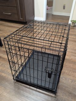 Small metal dog crate with removable bottom tray