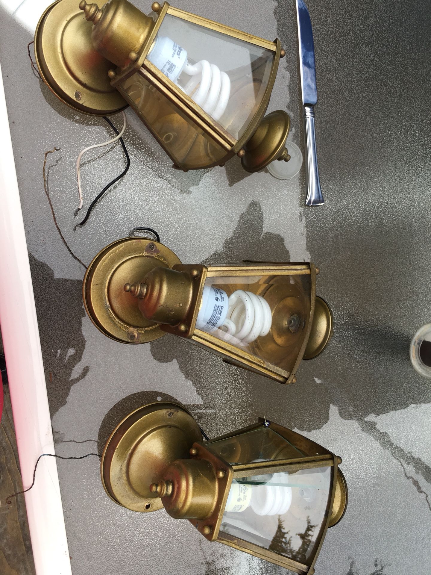 Three brass beveled-glass, exterior porch lights.