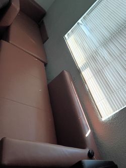 Sofa, two nearly new beds, two tables, and a TV.