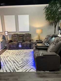 Luxurious look brown plush seating dual power reclining sofa w/theatre experience