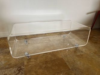 CB2 Peekaboo Acrylic Coffee Table on Wheels