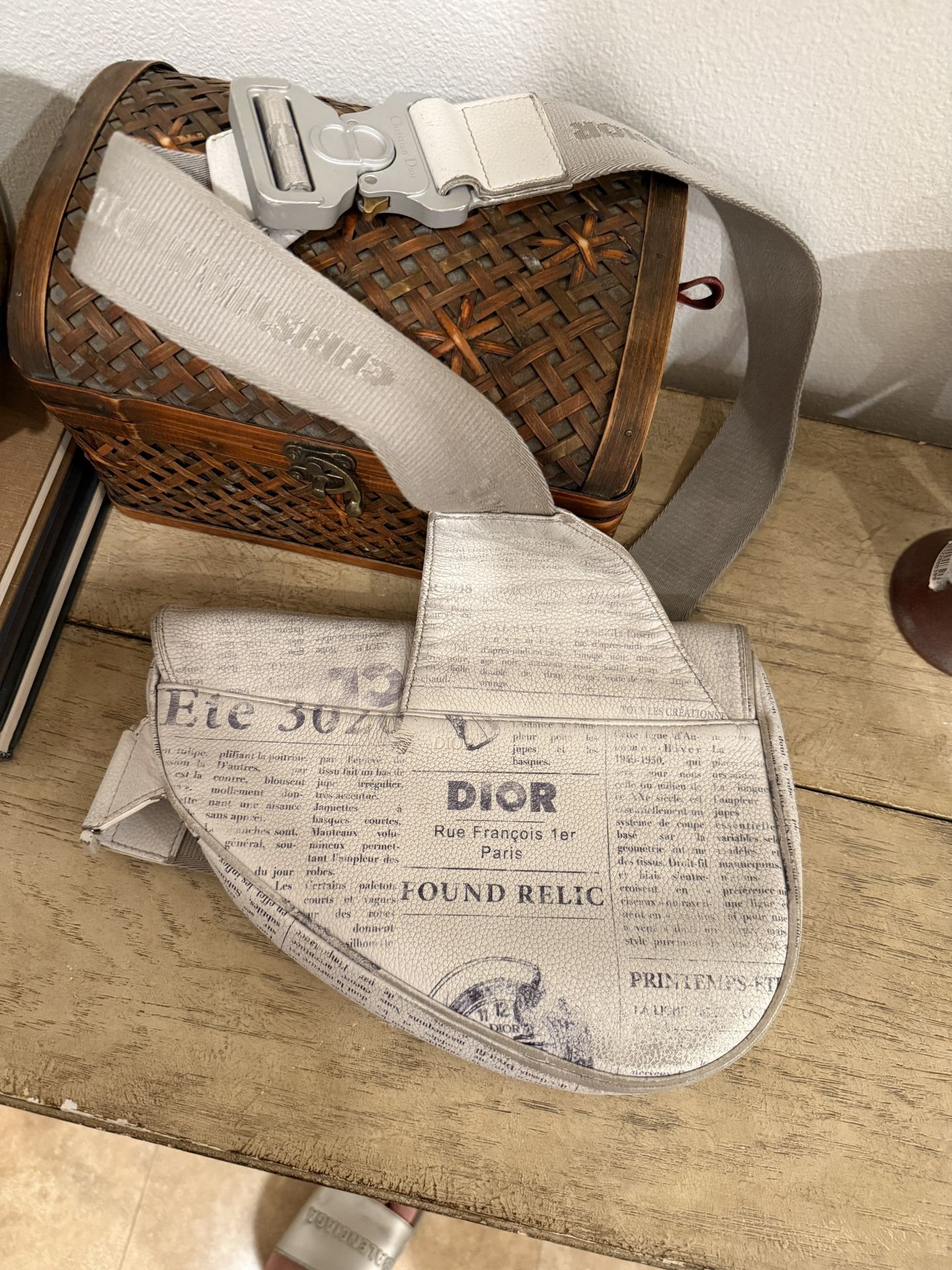 Christian Dior x Daniel Arsham “Newspaper” Saddle Satchel — White/Grey — Limited Edition (2019)
