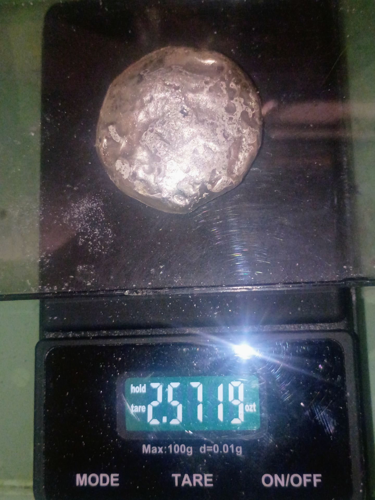 Silver button. 2.5 troy oz