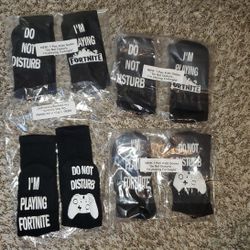 Kids socks bundle 
4 pair of " Do not disturb I'm playing Fortnite " 
All for $20 

