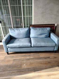 small blue loveseat
