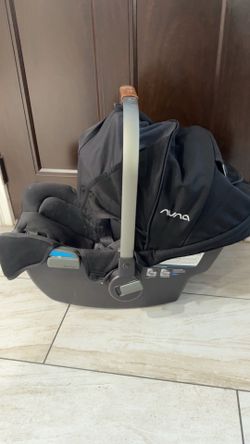 Nuna car seat with base and a car seat adapter for Uppababy stroller