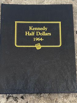 Book of Kennedy half dollar coins
