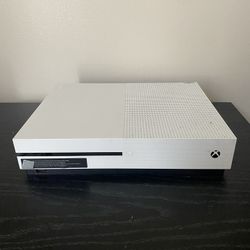 X box one S with two controllers and a headset 