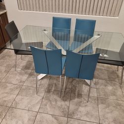 Modern glass table with Copenhagen leather chairs