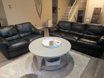 Set of two black leather couches
