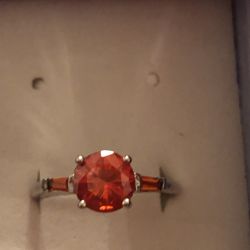 Size 10 silver ring with orange garnet