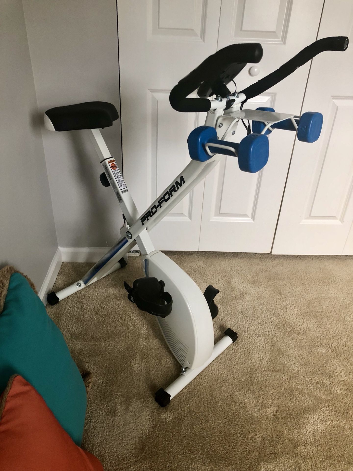 ProForm X Bike folding upright with 2 lb weights