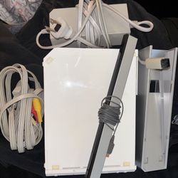 Used Nintendo Wii W/ Remotes, Games And Wheel Remotes
