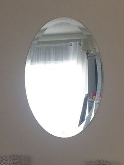 Beveled oval mirror