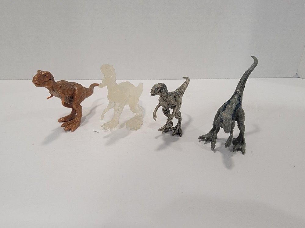 Lot of 4 Small Jurassic Park World Dinosaurs Toy Figures - Approx 2" Tall