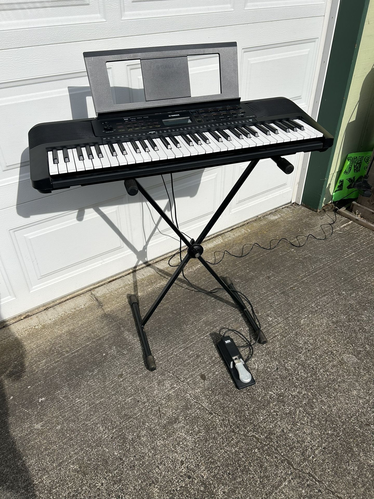 Yamaha E273 Keyboard - excellent w p/s, music stand Keyboard Stand, and sustain pedal. Everything works as it should. Lots of voices and sounds.